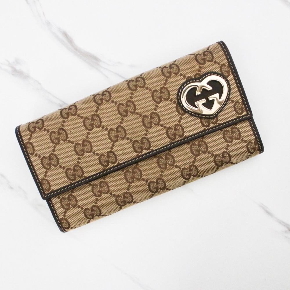 SOLD Authentic Gucci Women’s Bifold Wallet with Interlocking GG Heart